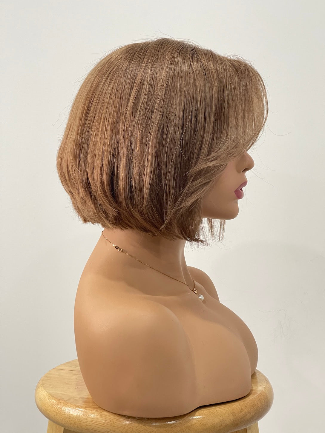 Image of Chestnut blunt bob with curtain bangs